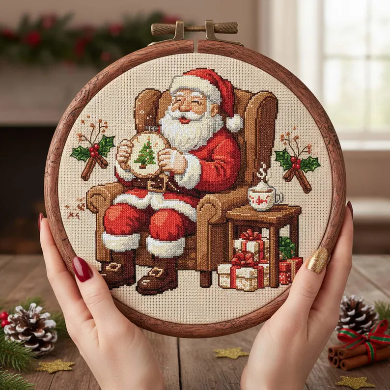 Santa Stitching Cross Stitch Pattern: Cozy Christmas Embroidery PDF with Santa Sewing a Tree and Gifts
